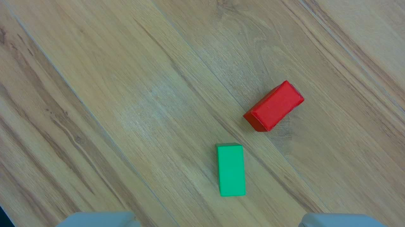 pi0 wrist camera with distractor red cuboid